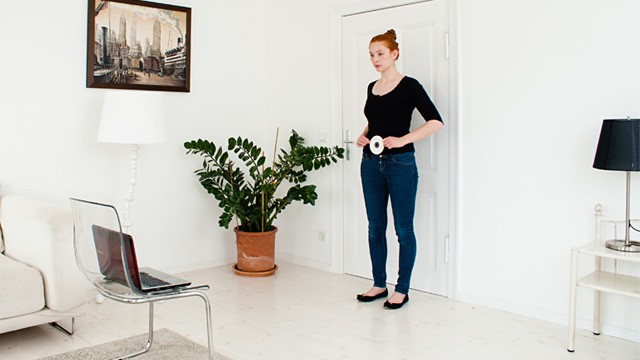 PHOTO: Woman having clothing measurements taken using webcam