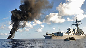 Photo: U.S. destroyer intercepts suspected pirates in the Somali Basin