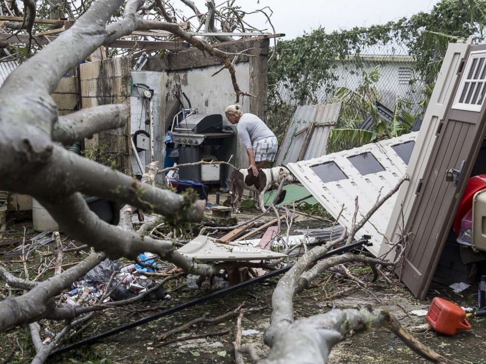PHOTO: A resident surveys the damage to her property after Hurricane Maria made landfall, Sept. 21, 2017, in the Guaynabo suburb of San Juan, Puerto Rico.