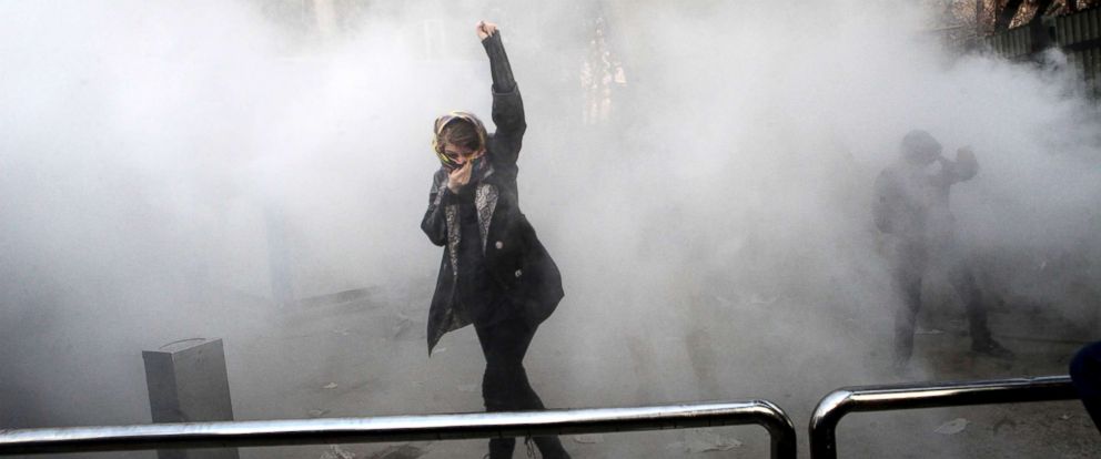 PHOTO: A university student attends a protest inside Tehran University as a smoke grenade is thrown by anti-riot Iranian police, in Tehran, Iran, Dec. 30, 2017, in a photo obtained by the AP.
