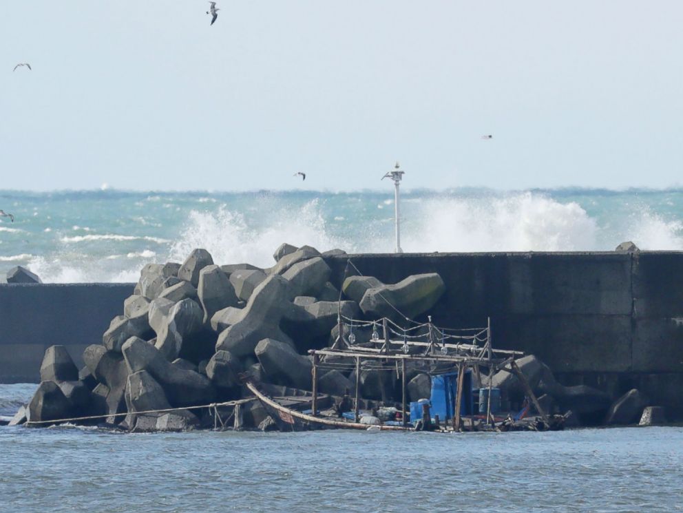 PHOTO: The wreckage of a boat is pictured along a sea wall in the city of Yurihonjo, Akita prefecture, Japan, Nov. 24, 2017.