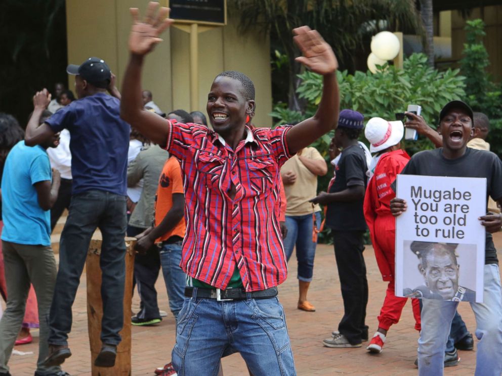 PHOTO: Zimbabweans celebrate in Harare, Tuesday, Nov, 21, 2017, after the resignation of President Robert Mugabe.