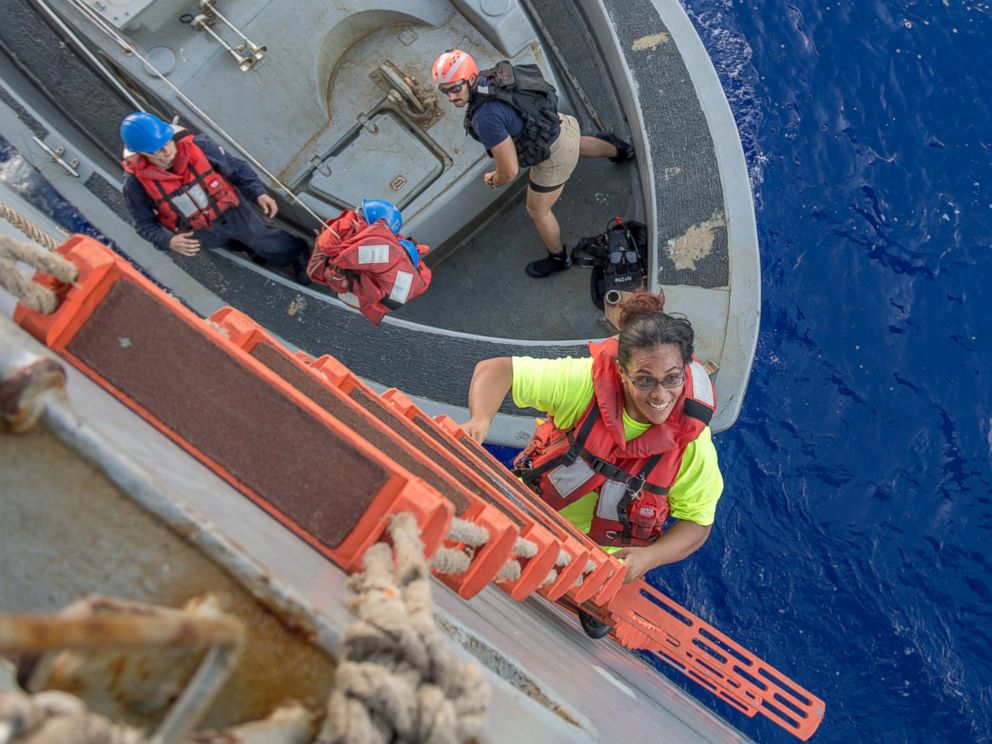 PHOTO: Tasha Fuiaba, an American mariner who had been sailing for five months on a damaged sailboat, climbs the accommodation ladder to board the amphibious dock landing ship USS Ashland (LSD 48), Oct. 25, 2017.