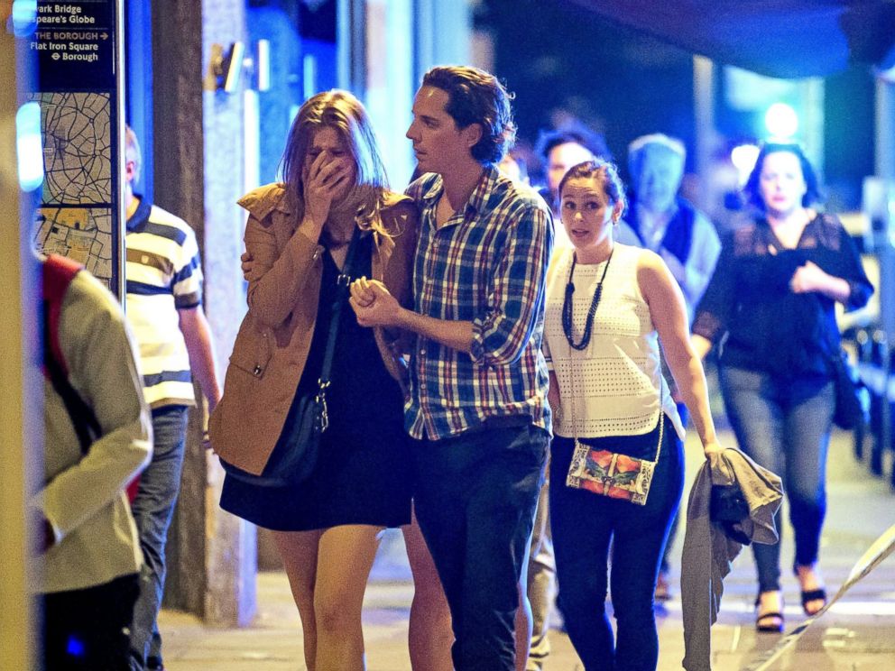 PHOTO: Members of the public flee near London Bridge after reports of an incident involving a vehicle and pedestrians, June 3, 2017 in London.