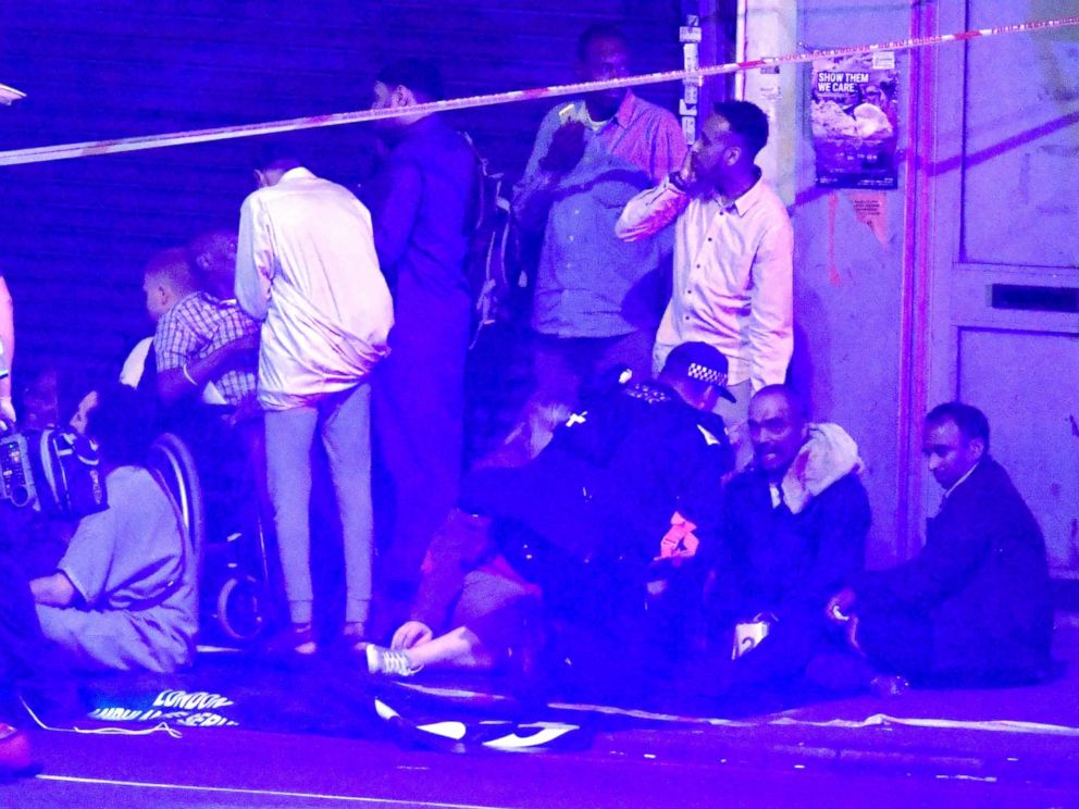 PHOTO: A first responder speaks to people at the scene of a traffic incident in Finsbury Park, London, June 18, 2017.