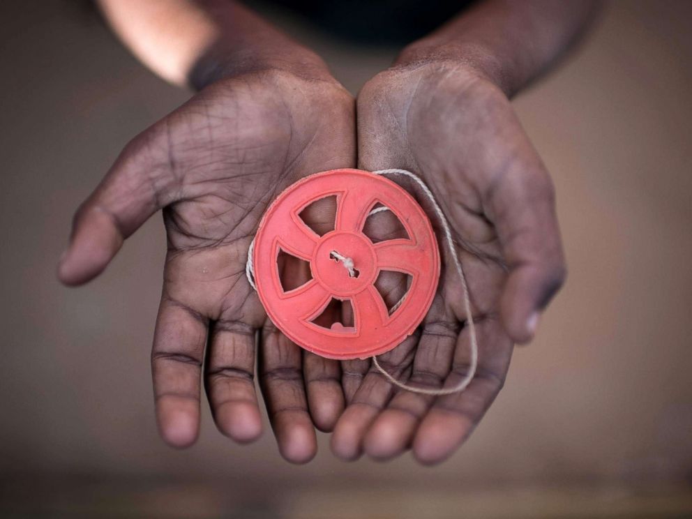 PHOTO: This photo taken on Nov. 29, 2017 shows a Rohingya migrant boy holding a spinning toy at the Kutupalong refugee camp in Coxs Bazar.