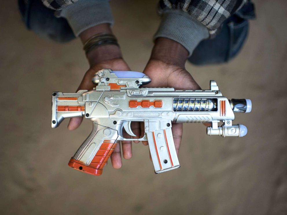 PHOTO: Rohingya migrant boy Saiful Islam (9), who fled Myanmar three years ago, holds a toy gun at the Shamlapur refugee camp in Coxs Bazar, Dec. 1, 2017.