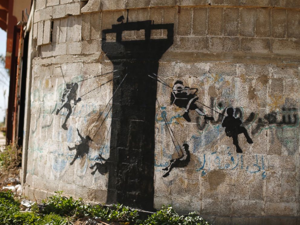 PHOTO: A mural, presumably painted by British street artist Banksy, is seen on a wall in Beit Hanoun town in the northern Gaza Strip, Feb. 26, 2015.