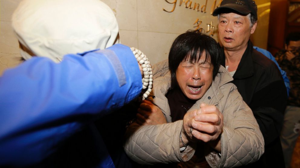 PHOTO: A family member of a passenger aboard Malaysia Airlines flight 370 cries after watching a television broadcast of a news conference, at the Lido hotel in Beijing, March 24, 2014.