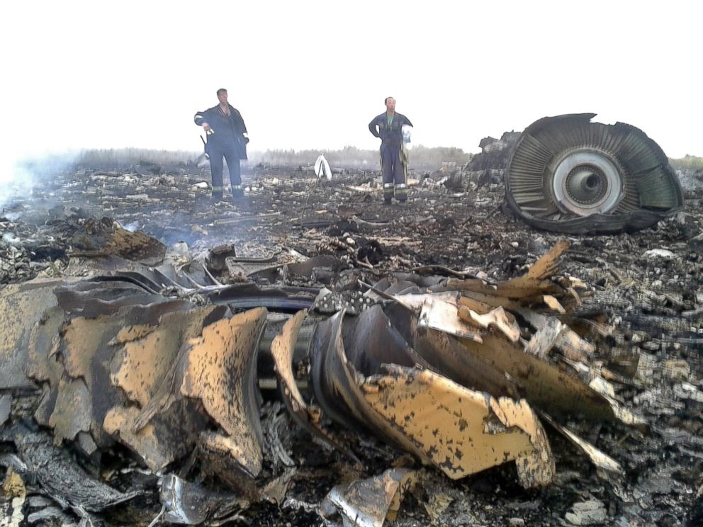 PHOTO: Emergencies Ministry members work at the site of a Malaysia Airlines Boeing 777 plane crash in the settlement of Grabovo in the Donetsk region, July 17, 2014.