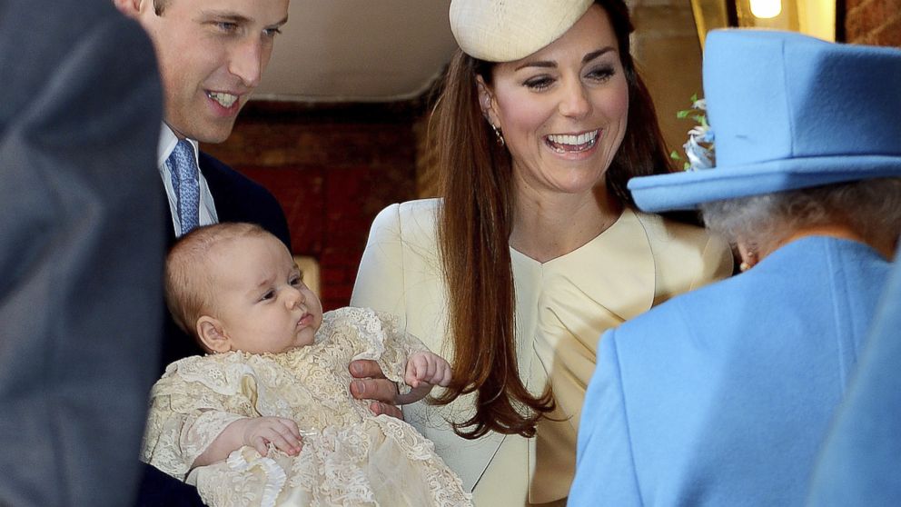 PHOTO: Britains Prince William carries his son Prince George, as he arrives with Kate, Duchess of Cambridge, for their sons christening at St Jamess Palace in London, Oct. 23, 2013.