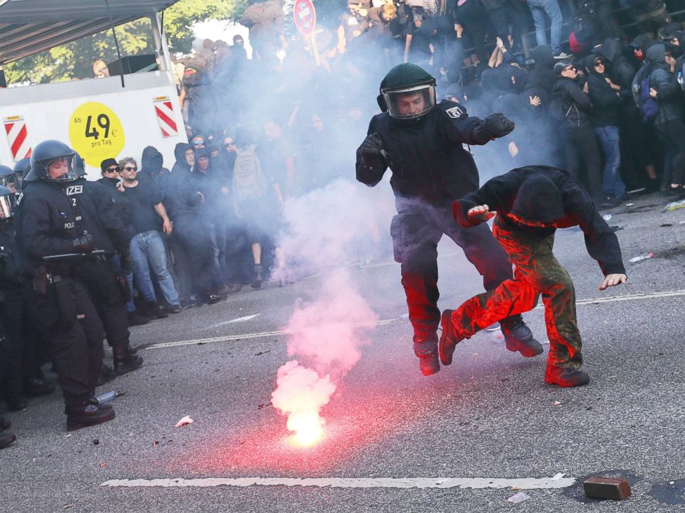PHOTO: German riot policemen catches protester during the demonstrations during the G-20 summit in Hamburg, Germany, July 6, 2017.