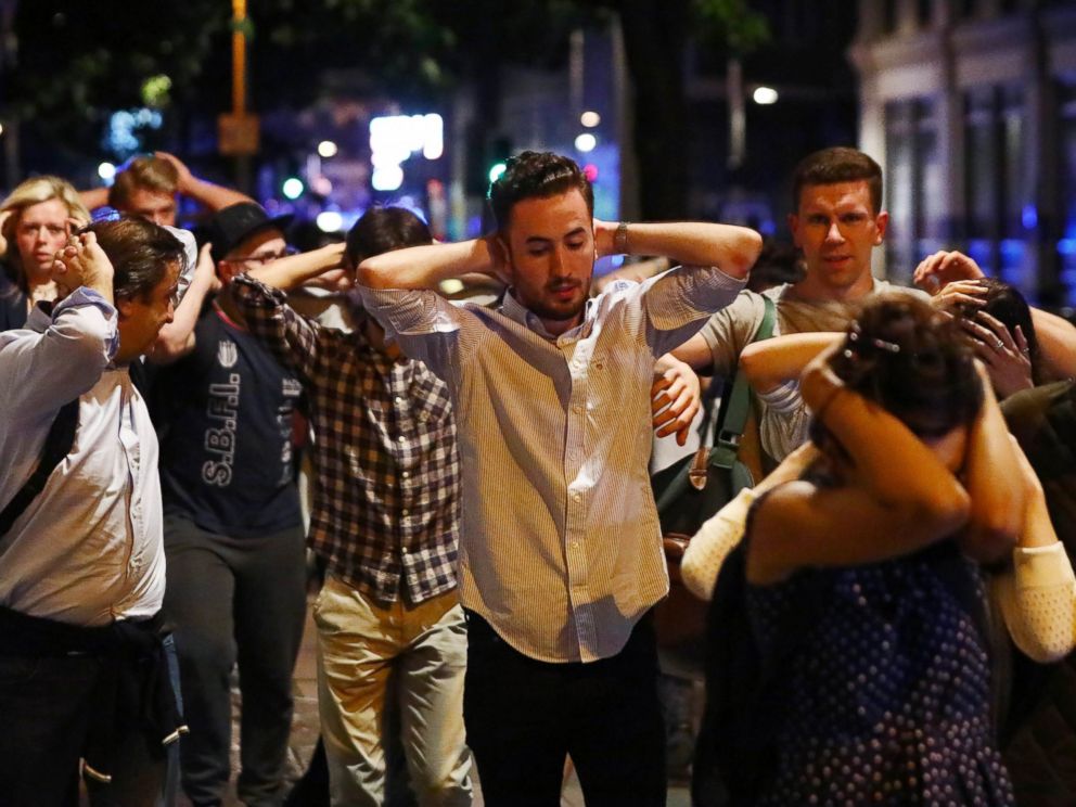 PHOTO: People leave the area with their hands up after an incident near London Bridge in London, June 4, 2017.