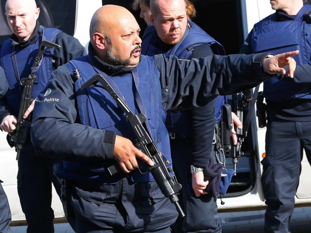 PHOTO: Police at the scene where shots were fired during a police search of a house in the suburb of Forest near Brussels, Belgium, March 15, 2016.
