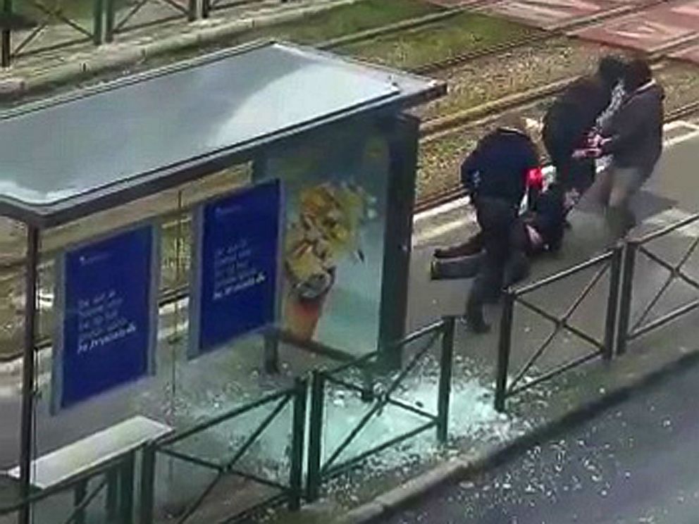 PHOTO: Belgian police drag a man along a rail platform in this still image taken from amateur video in the Brussels borough of Schaerbeek, Belgium, March 25, 2016.
