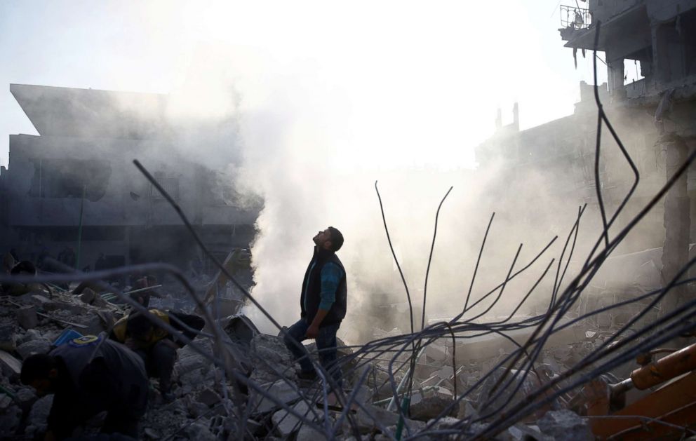 PHOTO: A man stands on rubble of damaged buildings after an airstrike in the Eastern Ghouta area outside Damascus, Syria, Jan. 9, 2018.