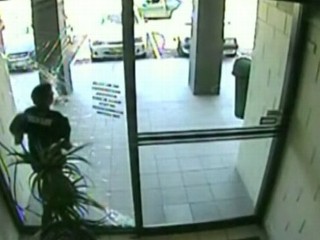 Watch: Purse-Snatcher Crashes Into Glass Door