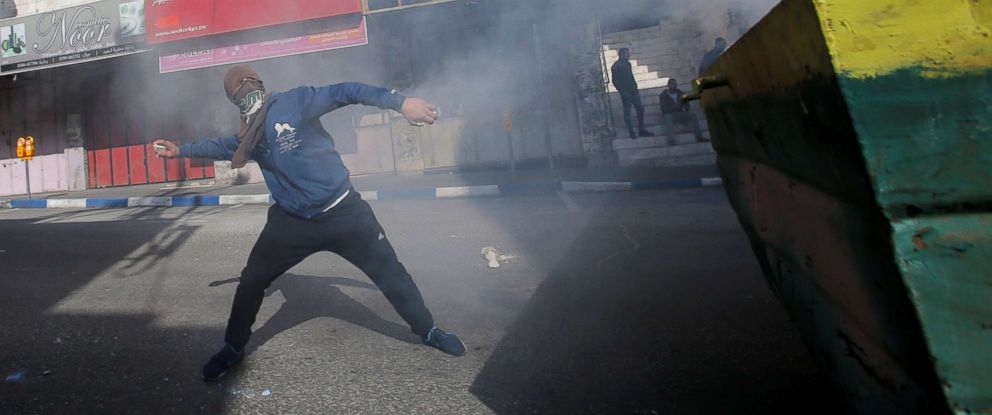 PHOTO: A Palestinian demonstrator hurls stones towards Israeli troops during clashes at a protest against President Donald Trumps decision to recognize Jerusalem as the capital of Israel, in the West Bank city of Hebron, Dec. 15, 2017.