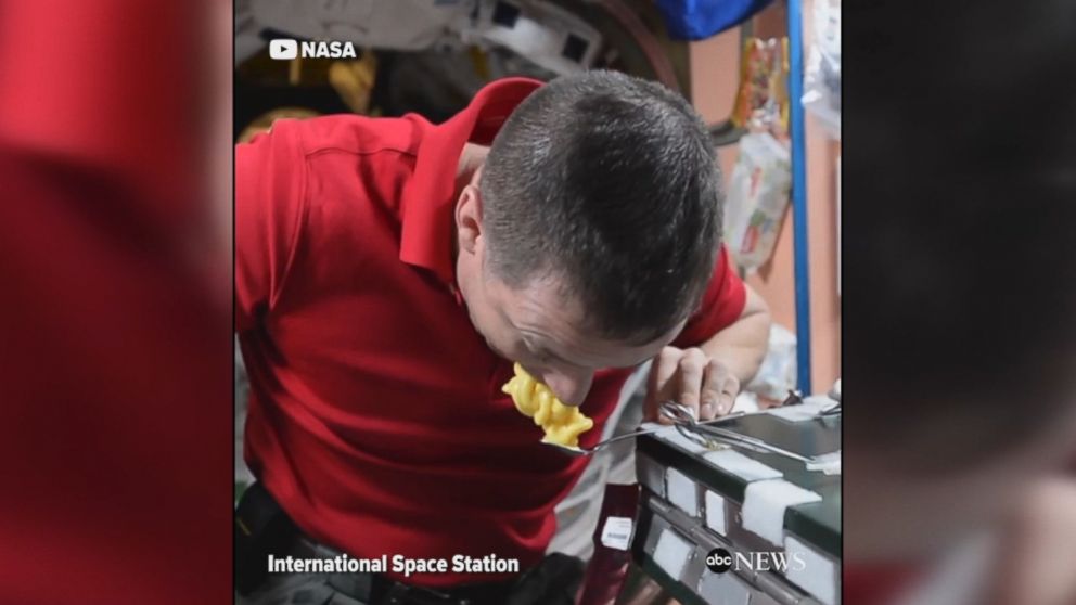 NASA astronaut Jack Fischer demonstrates how to eat pudding in zero gravity aboard the International Space Station.