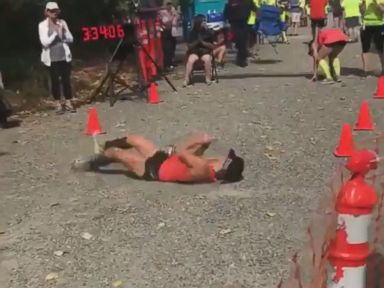 WATCH: Determined marathoner rolls to finish line