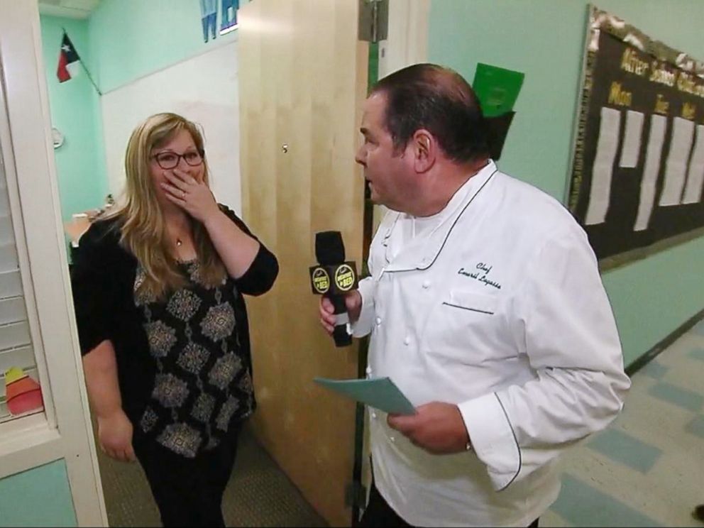 PHOTO: Emeril Lagasse named Lea Siegel, an educator from Fort Worth, Texas, the winner of his annual Breakfast in Bed search before leading her into the schools auditorium filled with students.