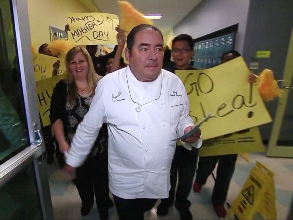 PHOTO: Emeril Lagasse named Lea Siegel, an educator from Fort Worth, Texas, the winner of his annual Breakfast in Bed search before leading her into the schools auditorium filled with students.