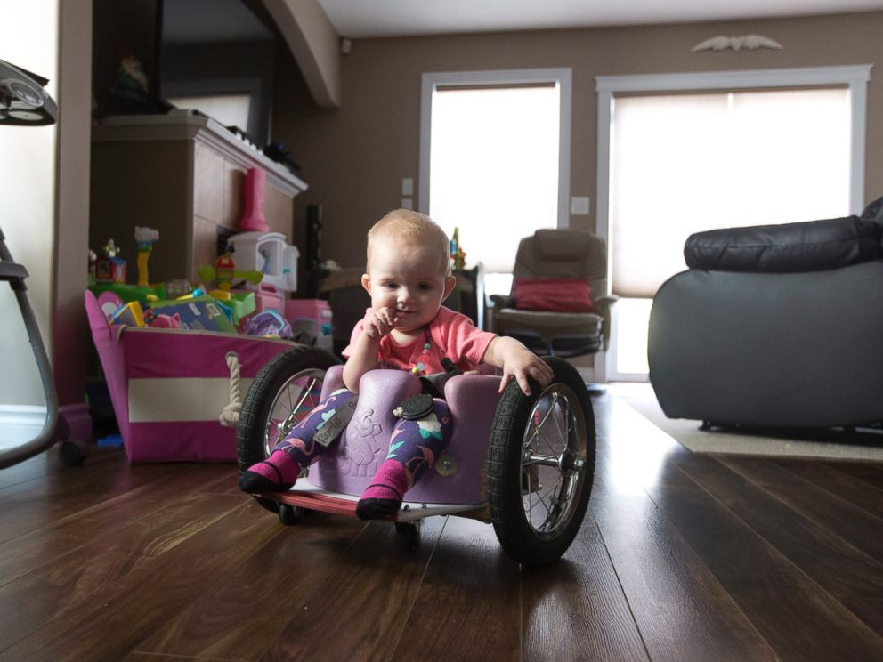 PHOTO: Kim Moore and her one-year-old daughter Evelyn Moore play at an indoor play ground in Edmonton Alberta, Canada, Aug. 9, 2016. Evelyn, also called Eva by her family, was diagnosed with cancer following her four-month check up.