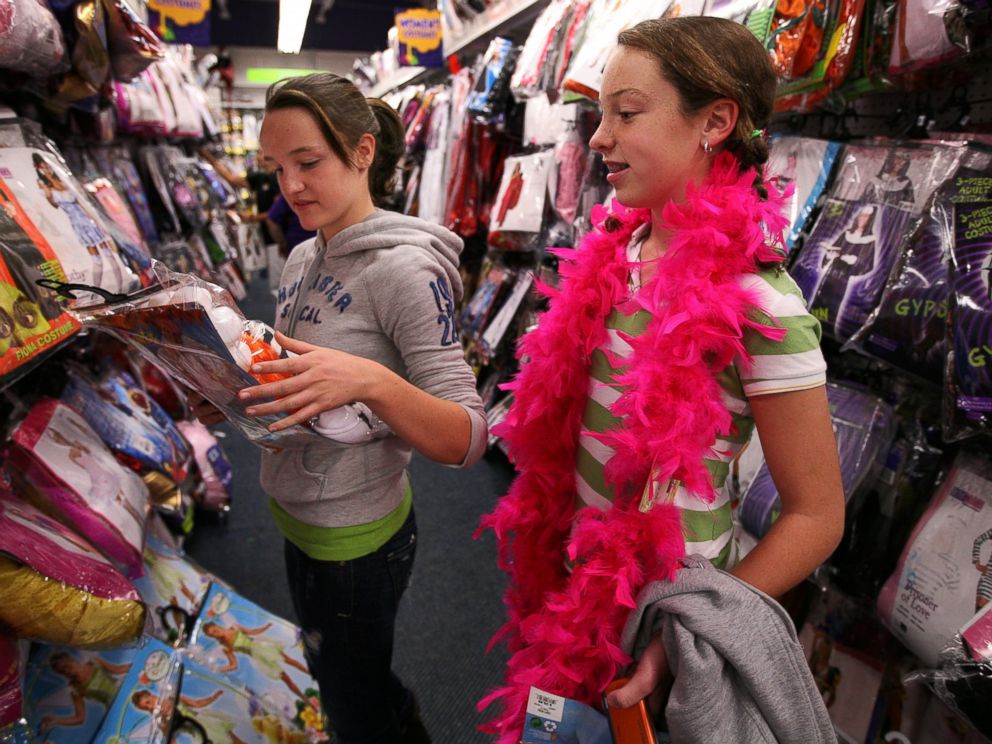 PHOTO: Maggie Ryan, 13, left, and Meredith Sullivan, 13, right, shop for Halloween costumes in this file photo. 