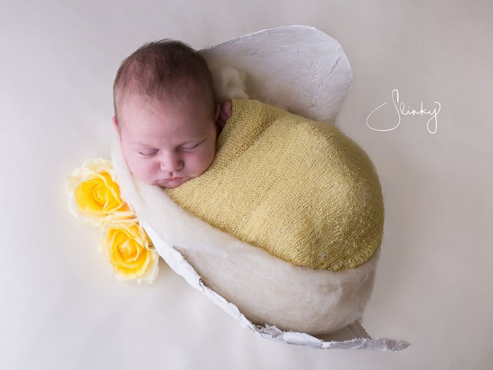 Babies Photographed Cuddled Up In Molds Of Their Moms Pregnant Bellies