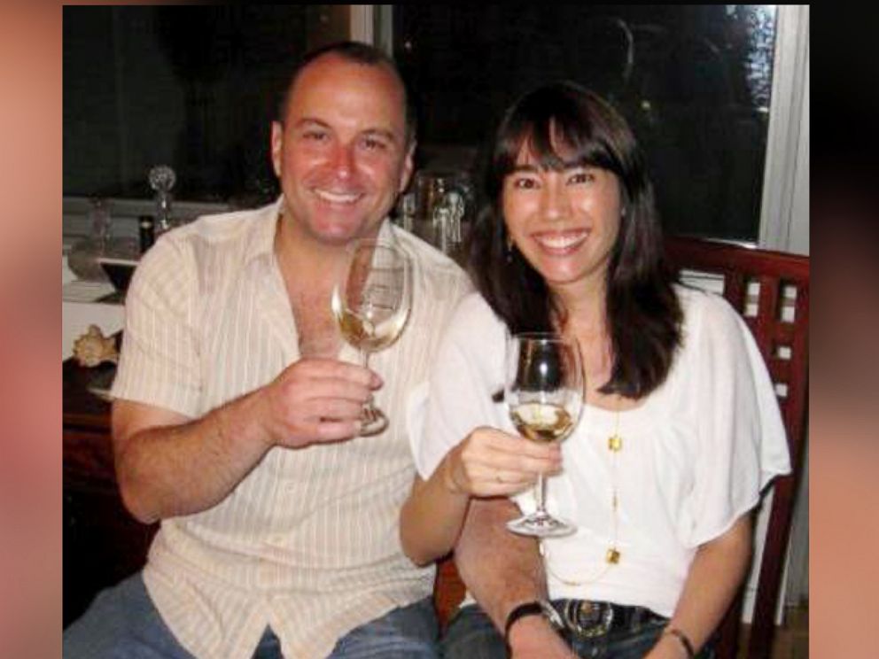 PHOTO: Vinotas Selections owner Michel Robert Abood sits with his wife and chief operating officer Veronica Moreno as they enjoy a glass of organic wine.