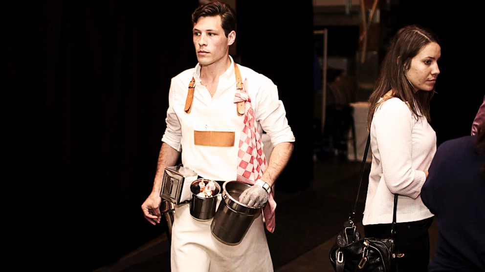 PHOTO: A waitstaff member of Oysters XO is armed with buckets for shucking oysters.