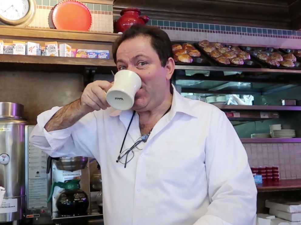 PHOTO: An employee at West Side Restaurant on 69th and Broadway consumes a cup of Vassilaros coffee.