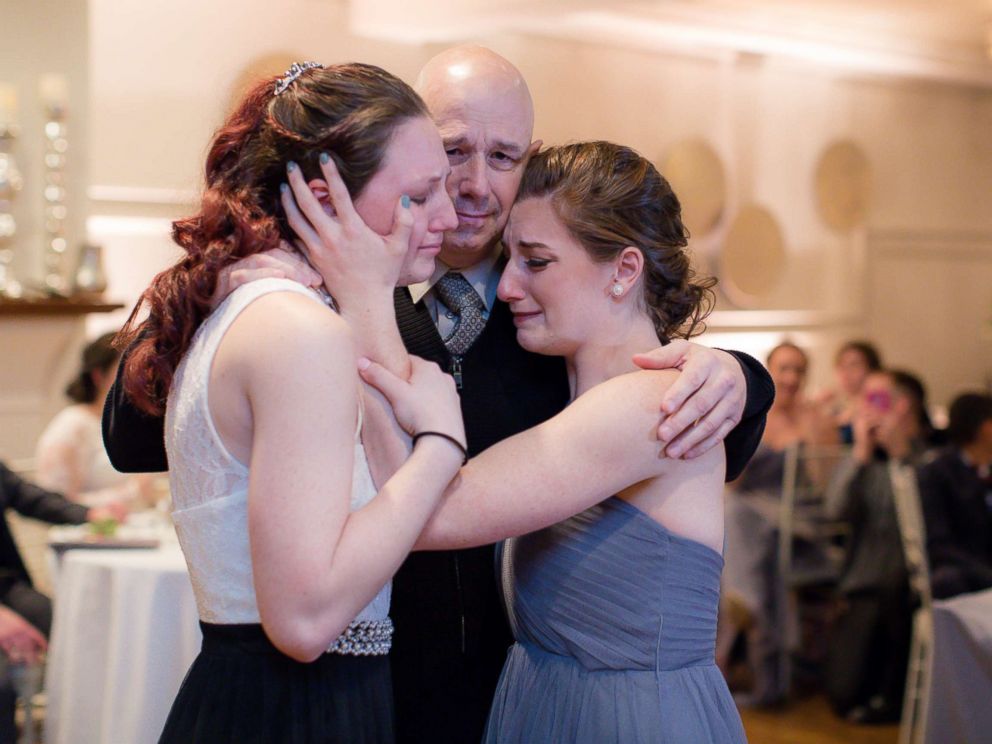 PHOTO: Jessica Otto and her sister with their dad, Peter Otto, at the wedding of their friend Michaela Cook-Yotts. 