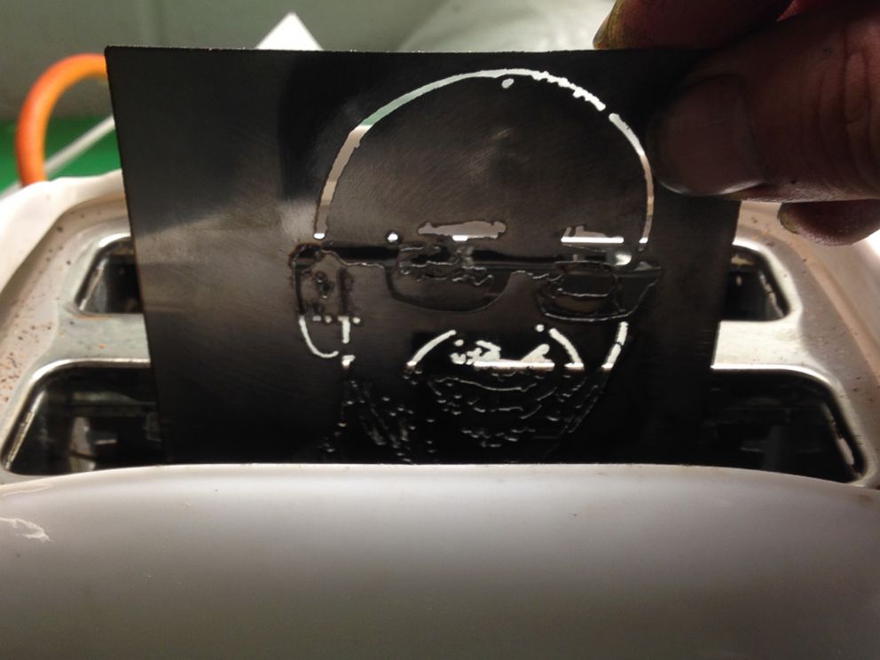 PHOTO: Toasters are fitted with customized plates before they are shipped to customers.