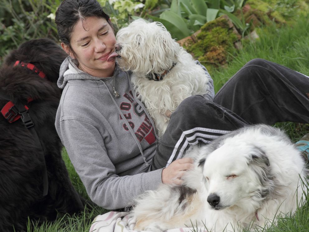 PHOTO: Owner Trisha is photographed with her dog Magoo, a blind and deaf therapy dog.