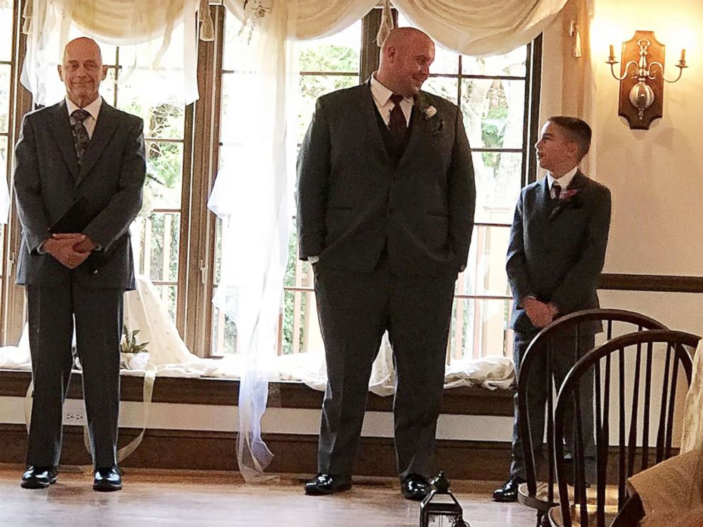 PHOTO: Kevin and Jaydon Rabatin stand at the altar anxiously awaiting the bride.