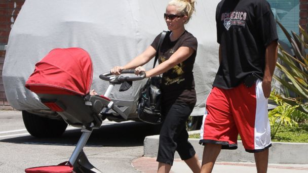 PHOTO: Kendra Wilkinson is seen with her husband Hank Baskett with their son in a Stokke Xplory stroller in Beverly Hills, Calif. on June 22, 2010.