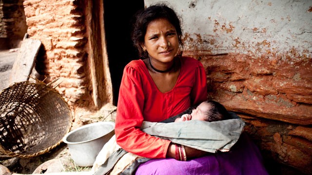 PHOTO: Maheshwori Devi Bishwokarma, 19, with her newborn daughter, Seema, in Dikha Village, Nepal.