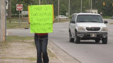 PHOTO: Quandria Bryant's father made her wear a roadside sign that said she had a "bad attitude" to atone for alleged bad behavior at her North Carolina high school.