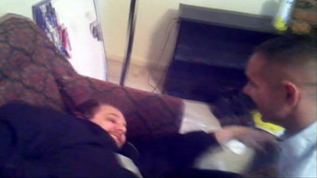 PHOTO: Brian Ecker being awakened by his brother.
