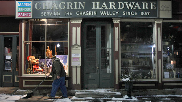 PHOTO: Rob Schwind shovels the sidewalk in front of the Chagrin Hardware in Chagrin Falls, Ohio, Jan. 21, 2012.