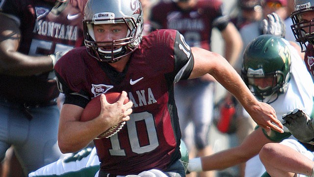 PHOTO: Montana quarterback Jordan Johnson (10) scrambles against Cal Poly during an NCAA college football game in Missoula, Mont., Sept. 10, 2011.