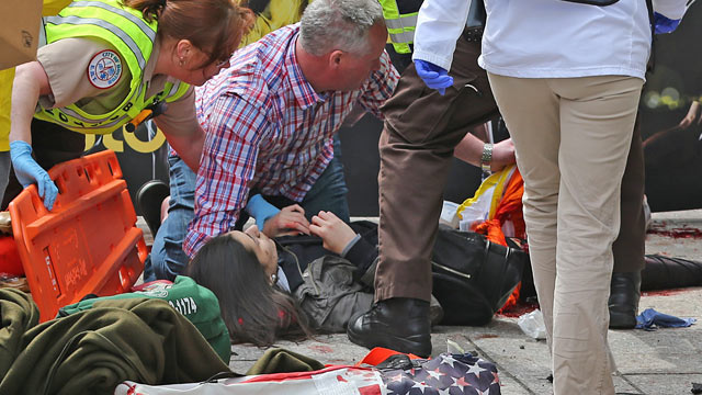 PHOTO: Emergency personnel respond to the scene after explosions went off near the finish line of the 117th Boston Marathon, April 15, 2013.