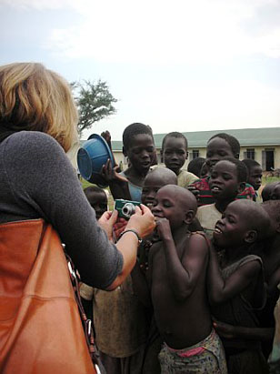 "Nightline" correspondent Vicki Mabrey photographs children at  the Awach IDP camp.  Most of them have never seen a digital camera before and loved seeing themselves.   