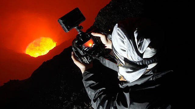PHOTO: ABC News Asia Producer Karson Yiu lies right on the edge of Mt. Marums crater.