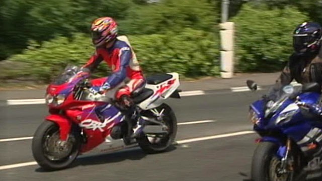 PHOTO: ABCs Simon McGregor-Wood, in the red suit, took a ride on the Isle of Man TT race circuit on "Mad Sunday," June 5, 2011.