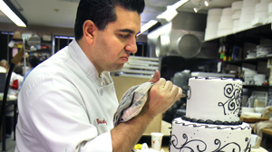 PHOTO Buddy Valastro of TLC?s "Cake Boss" puts the finishes touches on his latest confectionary creation.