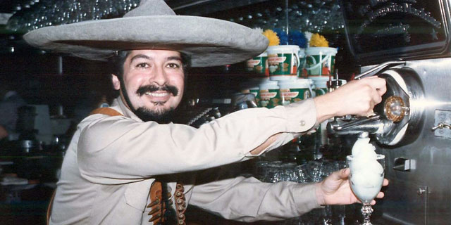 PHOTO: Mariano Martinez prepares the perfect frozen margarita.