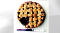 Lattice-top blueberry pie is shown.