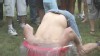 VIDEO: Bobbing for pigs' feet, dumpster diving and the hubcap hurl.